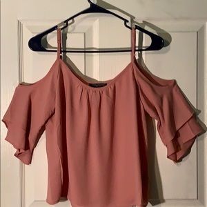 Cold shoulder top in peach color.